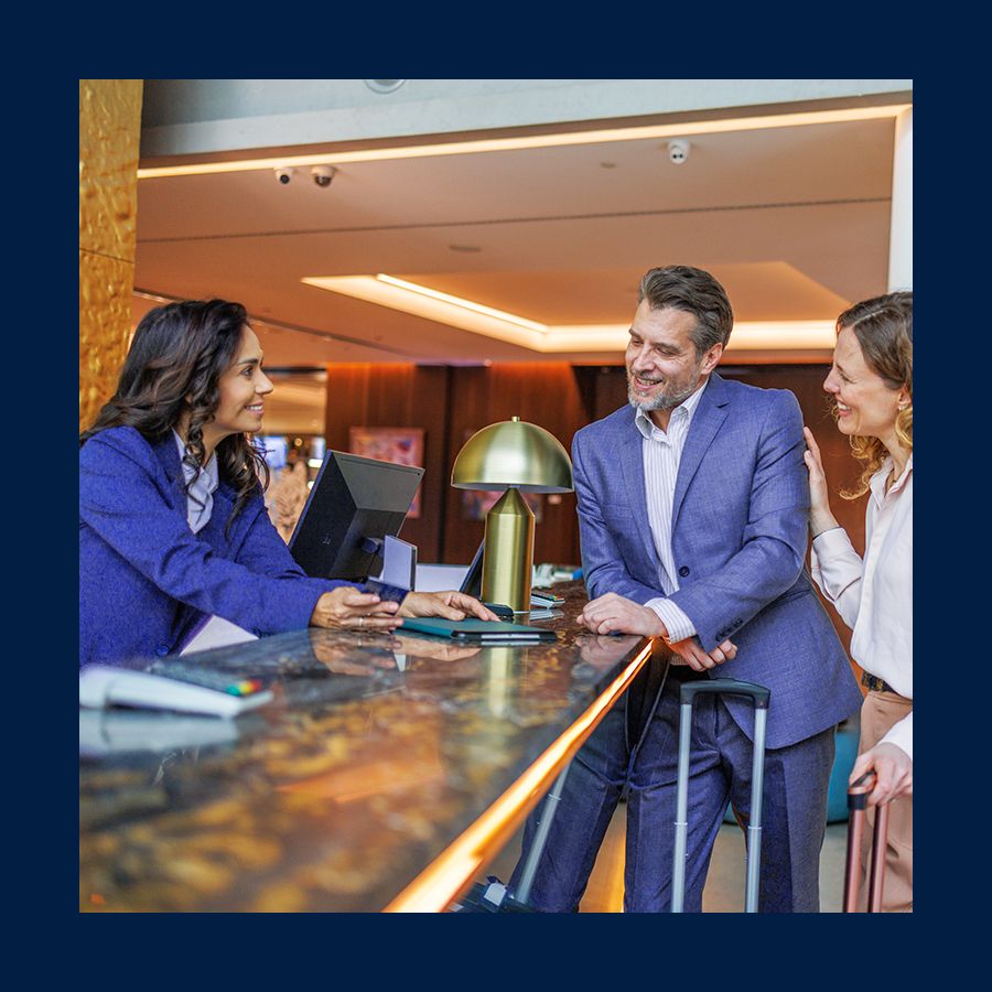 Guests checking-in at concierge desk