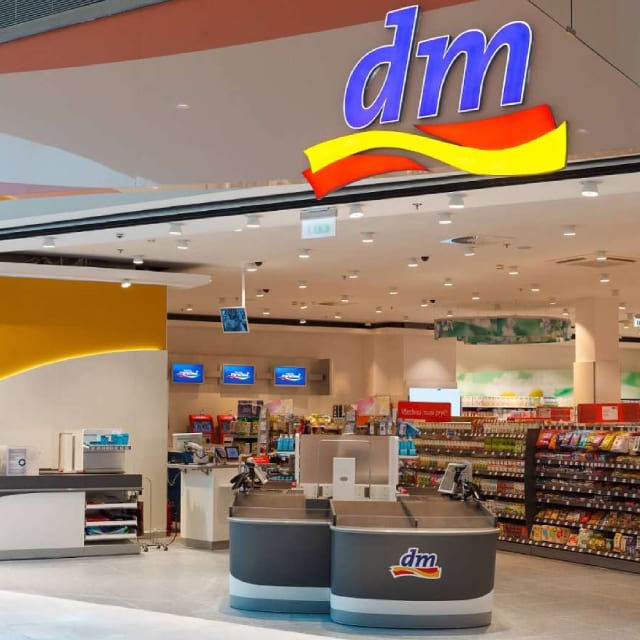 Free checkout counters for customer service and a brightly coloured DM shop sign