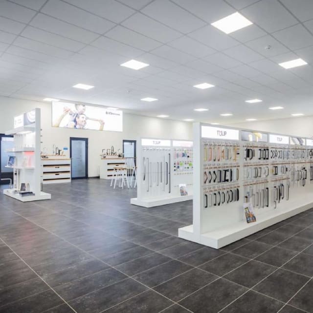 Lighted and spacious shop interior with retail shelving 