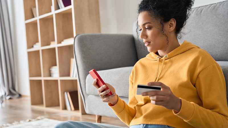 Woman on phone making payment