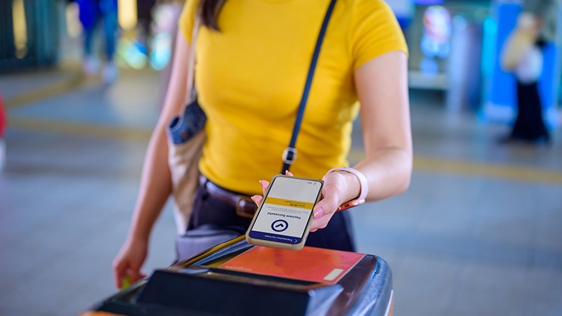 Woman paying for ticket