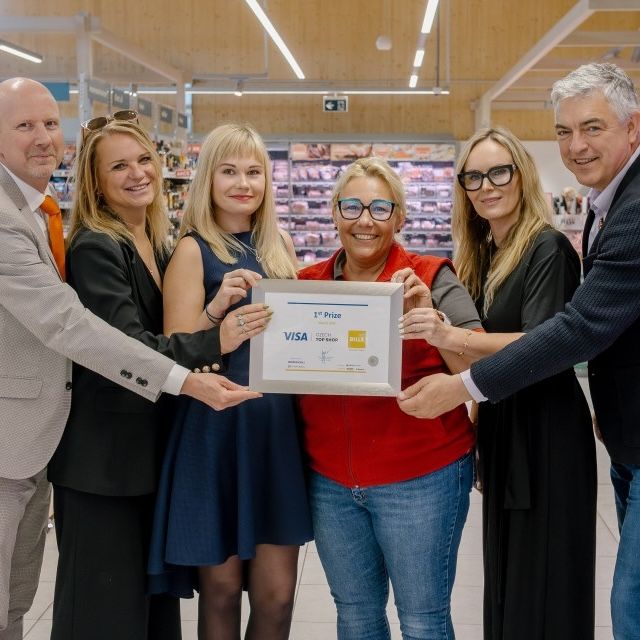 group of people posing with award