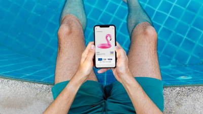 Man using phone in pool